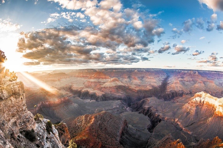12 Grand Canyon, Arizona Grand Canyon or Grand Canyon is a steep ravine created by the Colorado River in the US state of Arizona.  The Grand Canyon lies almost entirely within Grand Canyon National Park - one of the first national parks established in the United States.